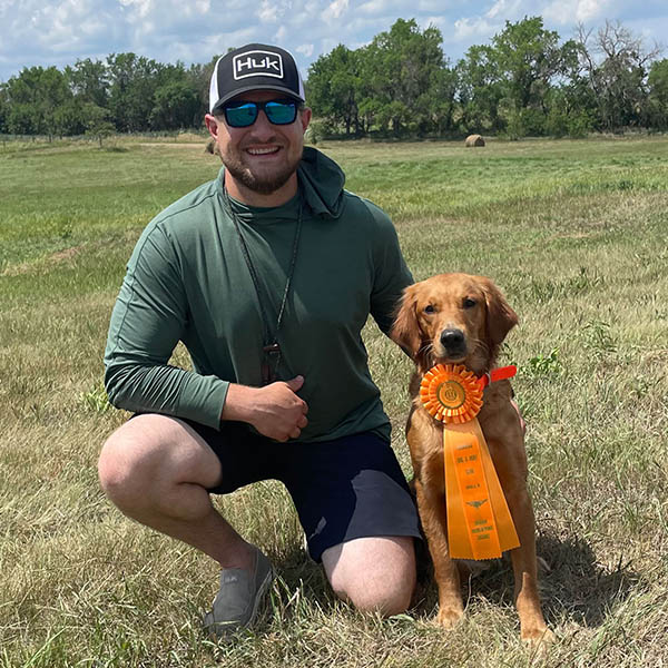 Platte River Golden Retriever dog with ribbon for winning hunt test